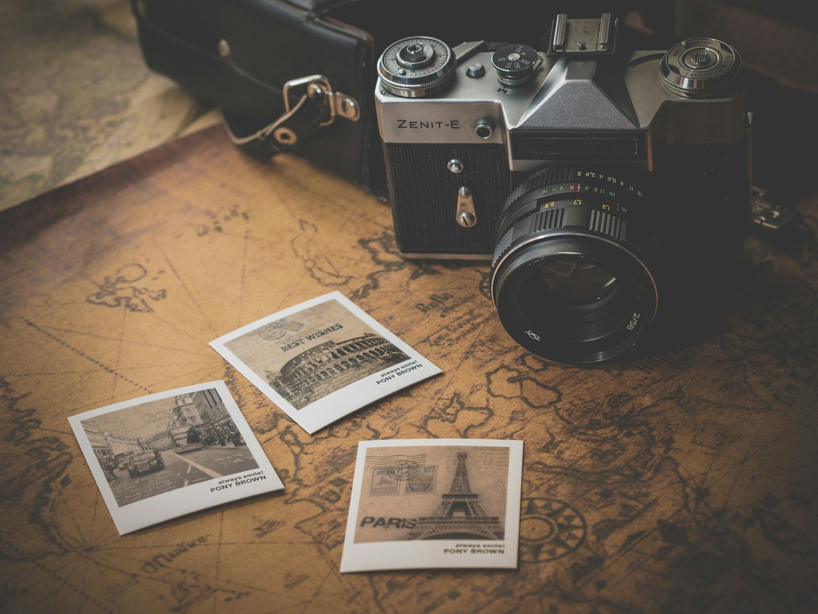 Vintage camera with printed wedding photos