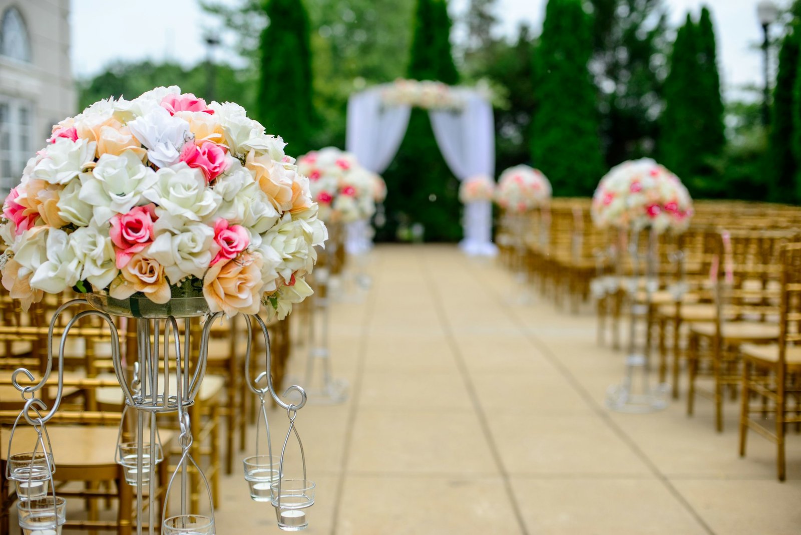 Garden ceremony aisle lined with flowers