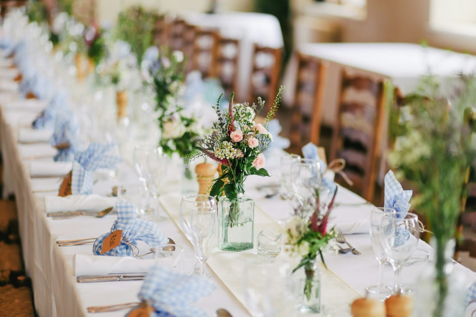Example only: long reception table with glassware