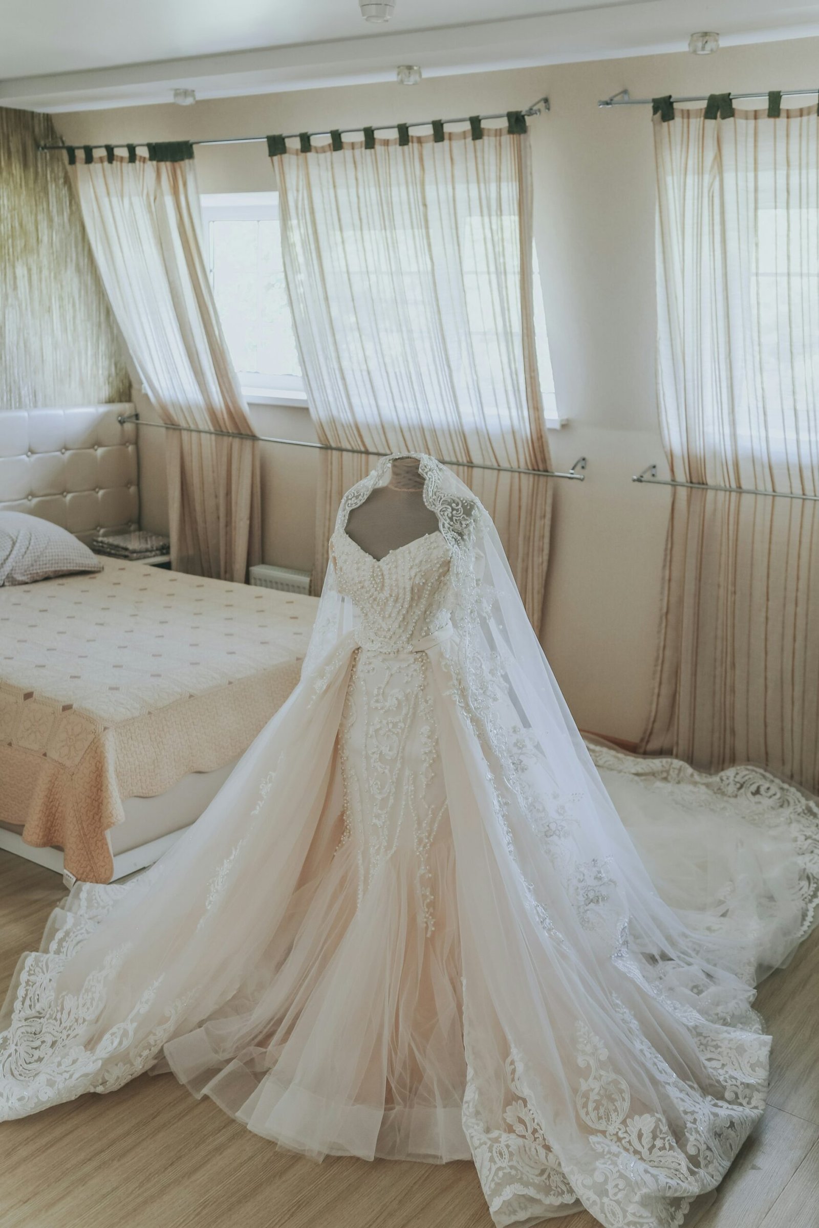 Wedding dress hanging in a bright room